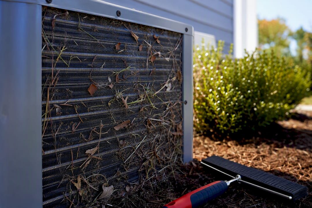 Debris blocking outdoor condenser coil fins