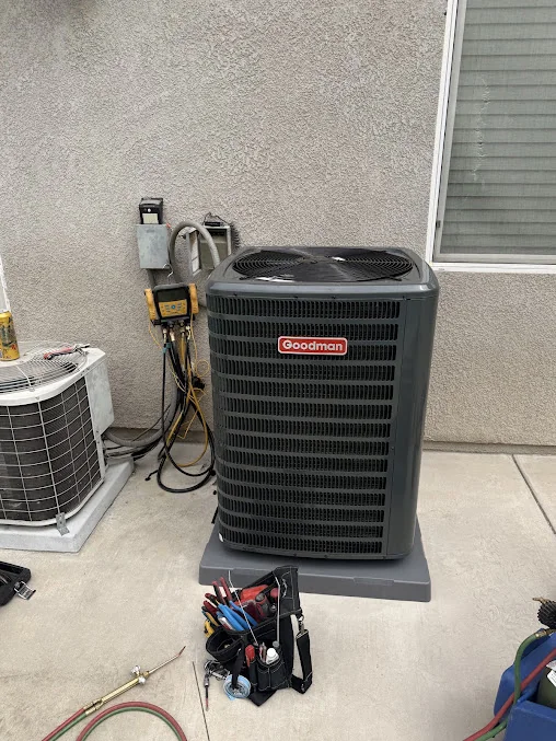 Outdoor air conditioner with service hoses and HVAC equipment
